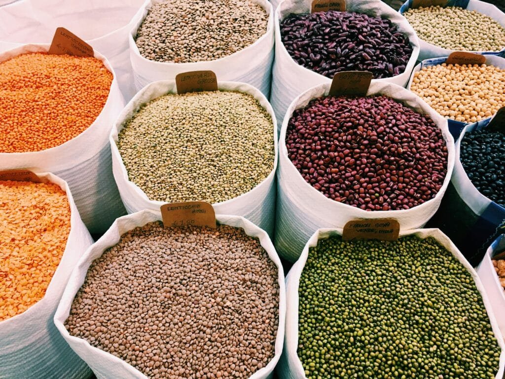 Assorted dried grains, lentils and pulses arranged in containers