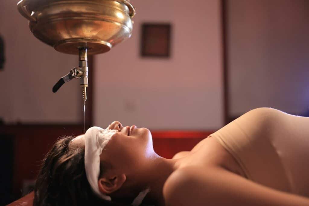 Traditional Ayurvedic oil massage, or abhyanga, performed as part of a daily-care routine