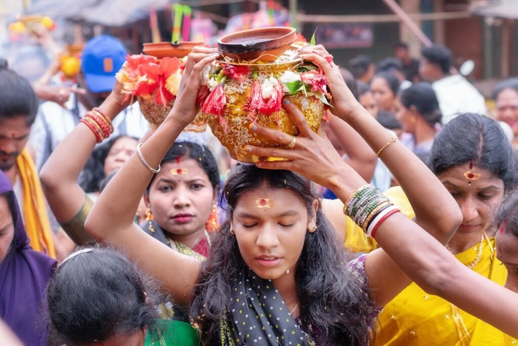 A Hindu worshipper using water in a bathing or purification context before ritual