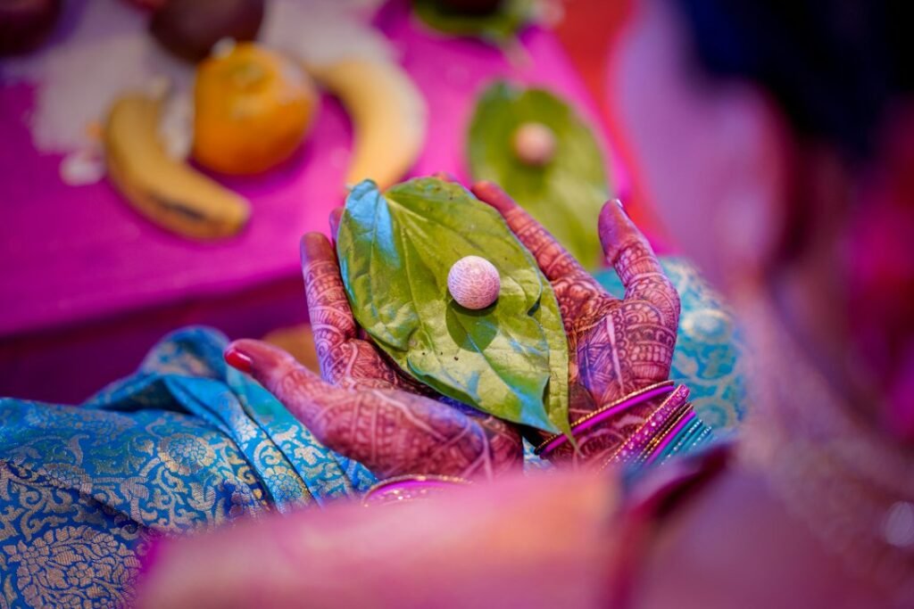 A family gathered around an infant in a traditional naming or blessing ceremony