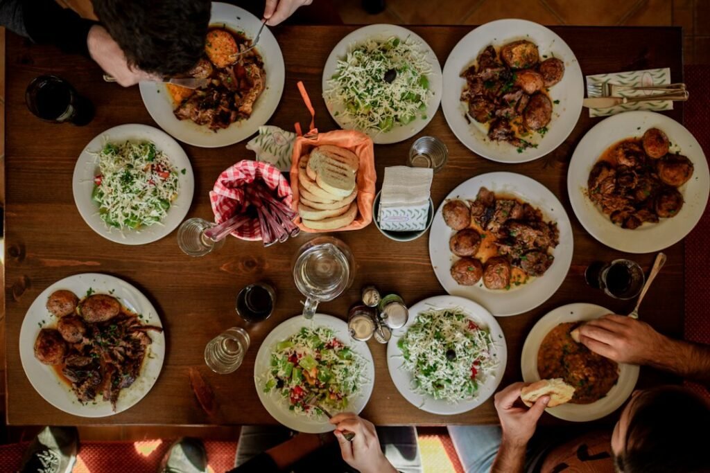 A family or community sharing food after a funeral or mourning gathering