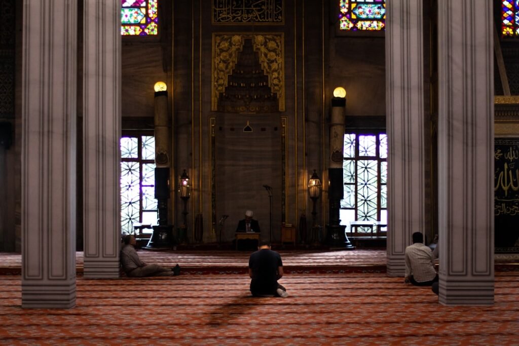 Muslims performing salat together in a mosque, illustrating fixed daily prayer times