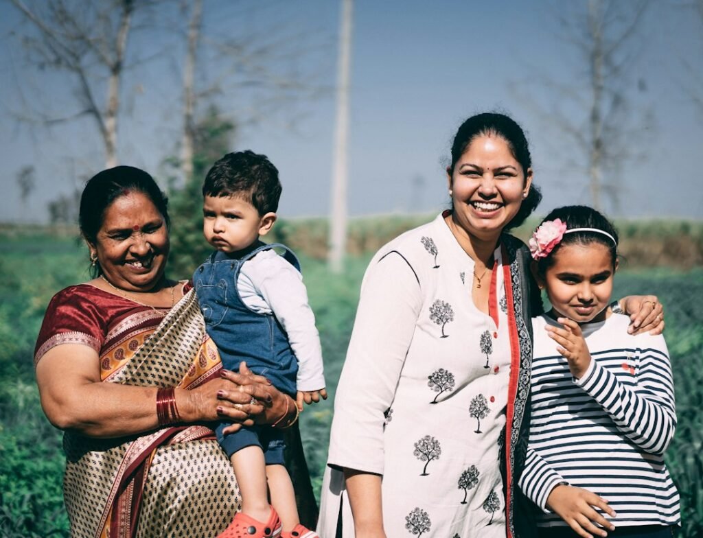 A pregnant woman with food in a family setting, representing culturally shaped dietary rules during pregnancy