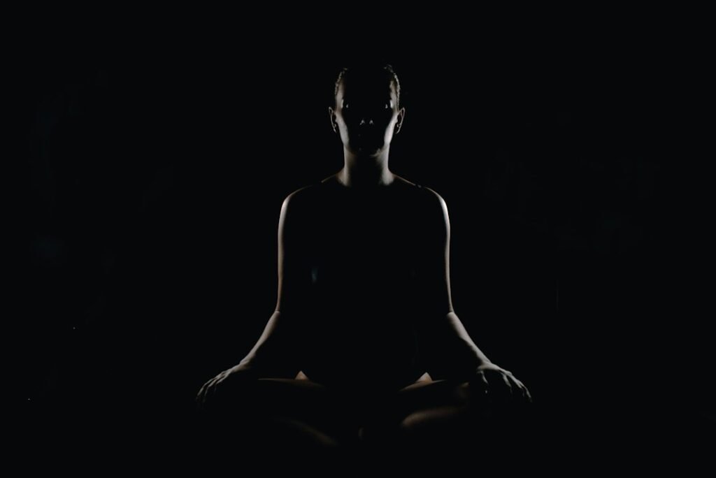 A person seated quietly in a meditation posture