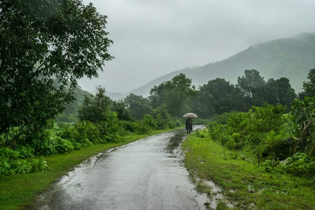 Monsoon rain over an Indian agricultural landscape, illustrating the seasonal cycle that shaped calendars and rituals