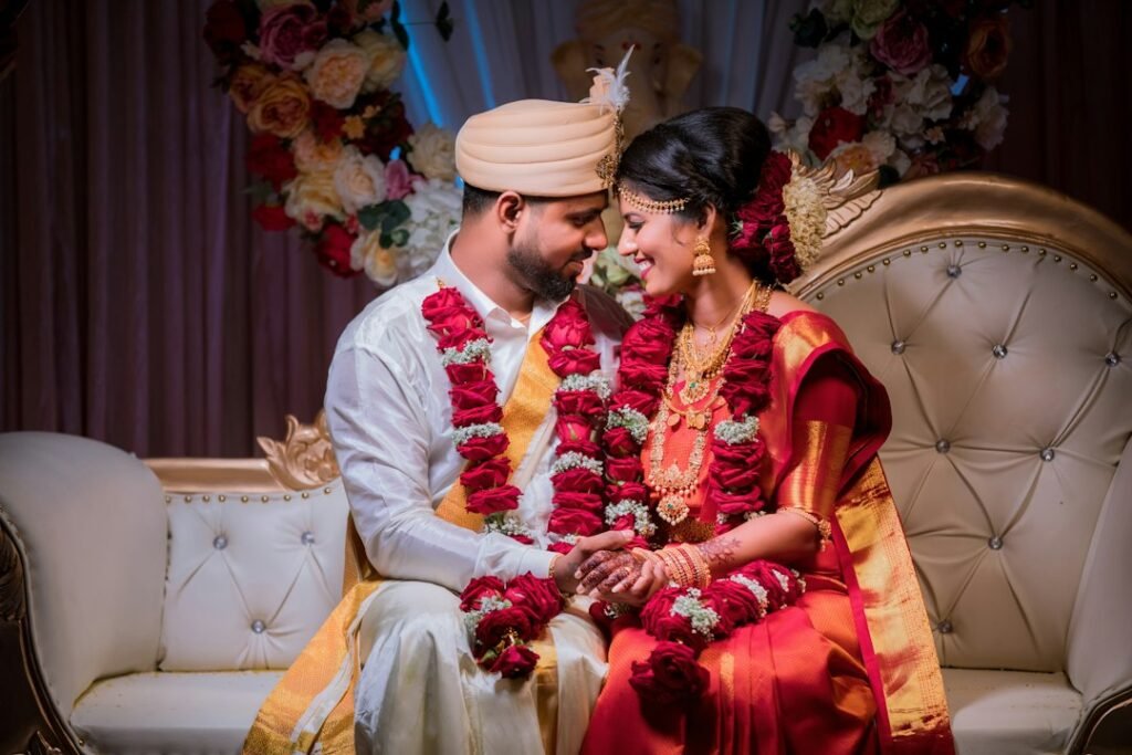A South Indian ceremonial setting with flowers and traditional dress, used respectfully to represent puberty and coming-of-age observances