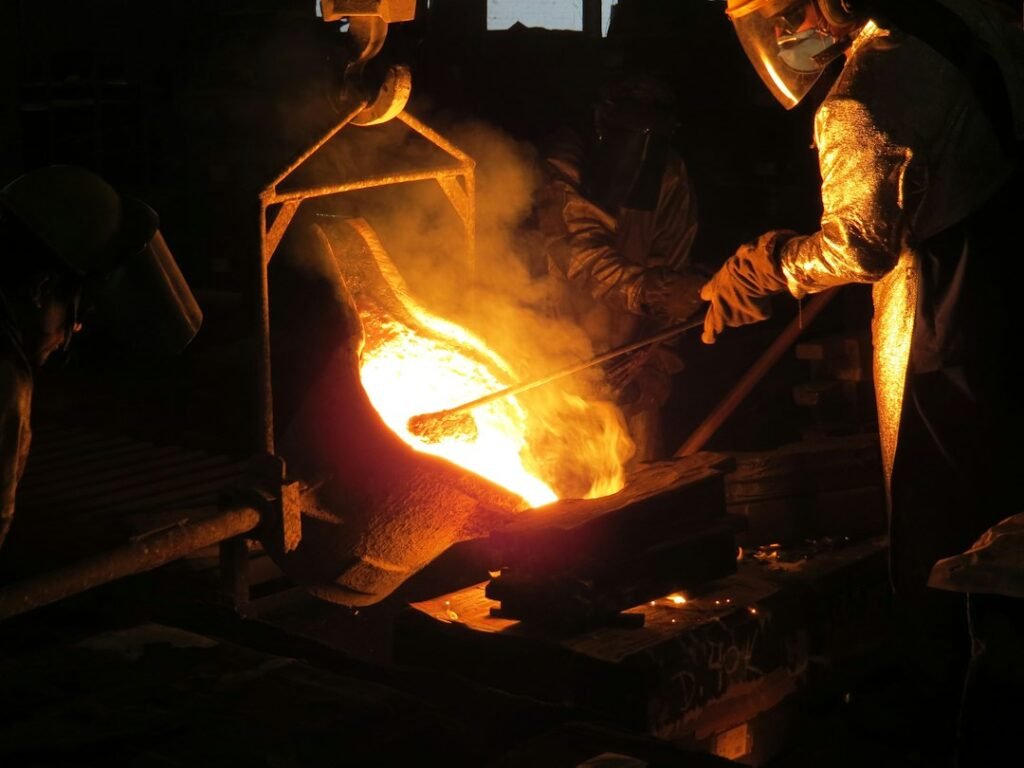 A blacksmith working hot steel at a forge, representing the metallurgical skill behind high-carbon steels such as wootz